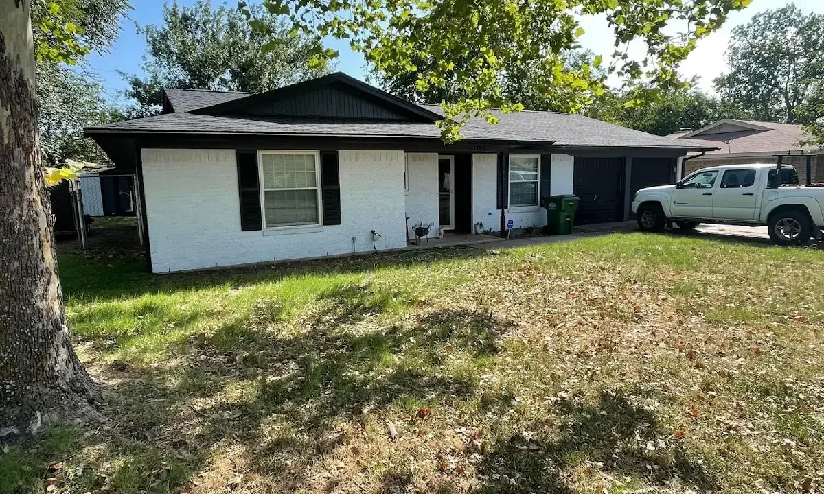 Professional roofing crew working on a residential roof in Old Orchard Beach